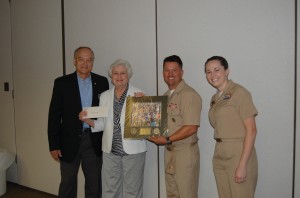 Joe Dougherty (STAR Foundation), Andrea Lawrence, Capt. Scott Kraverath, Vanderbilt ROTC, and Lt. Bria Chambers, Vanderbilt ROTC, presentation of check and remembrance photo from the "Run for Veterans"