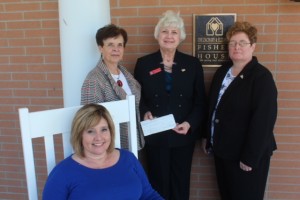 On the front porch of the new TN Fisher House - seated, Tammy Bivens of J & S Restaurants, Brenda Eckard, J & S Restaurants, Andrea Lawrence, and FH Board Member Felicia Hix