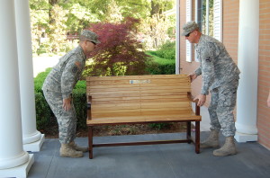 SPC Chris Evans and SGT Clint Reid carefully placing their work on the front porch