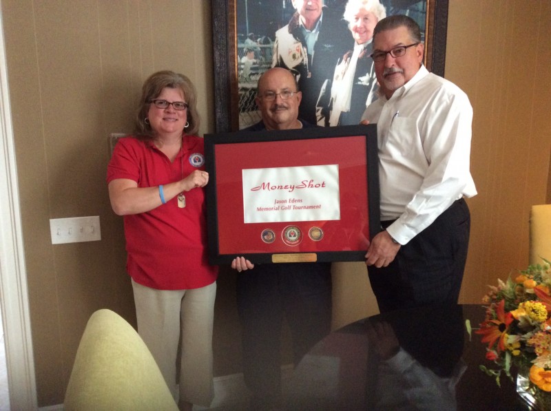 Jan and Jim Edens with flag from Money Shot 1