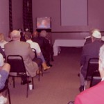 Attendees viewing the Fisher House DVD