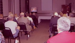 Attendees viewing the Fisher House DVD